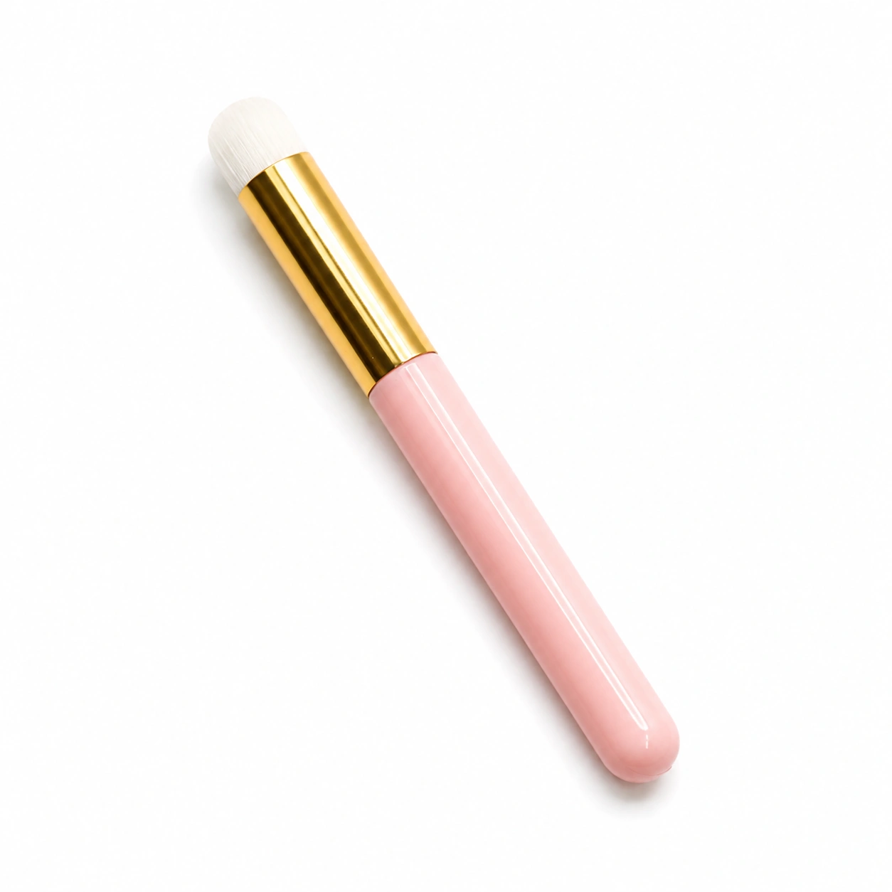 Pink soft-bristled lash cleansing brush for gently deep-cleaning eyelash extensions with foaming lash shampoo.