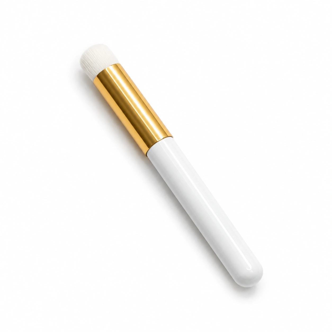 White soft-bristled lash cleansing brush for gently deep-cleaning eyelash extensions with foaming lash shampoo.