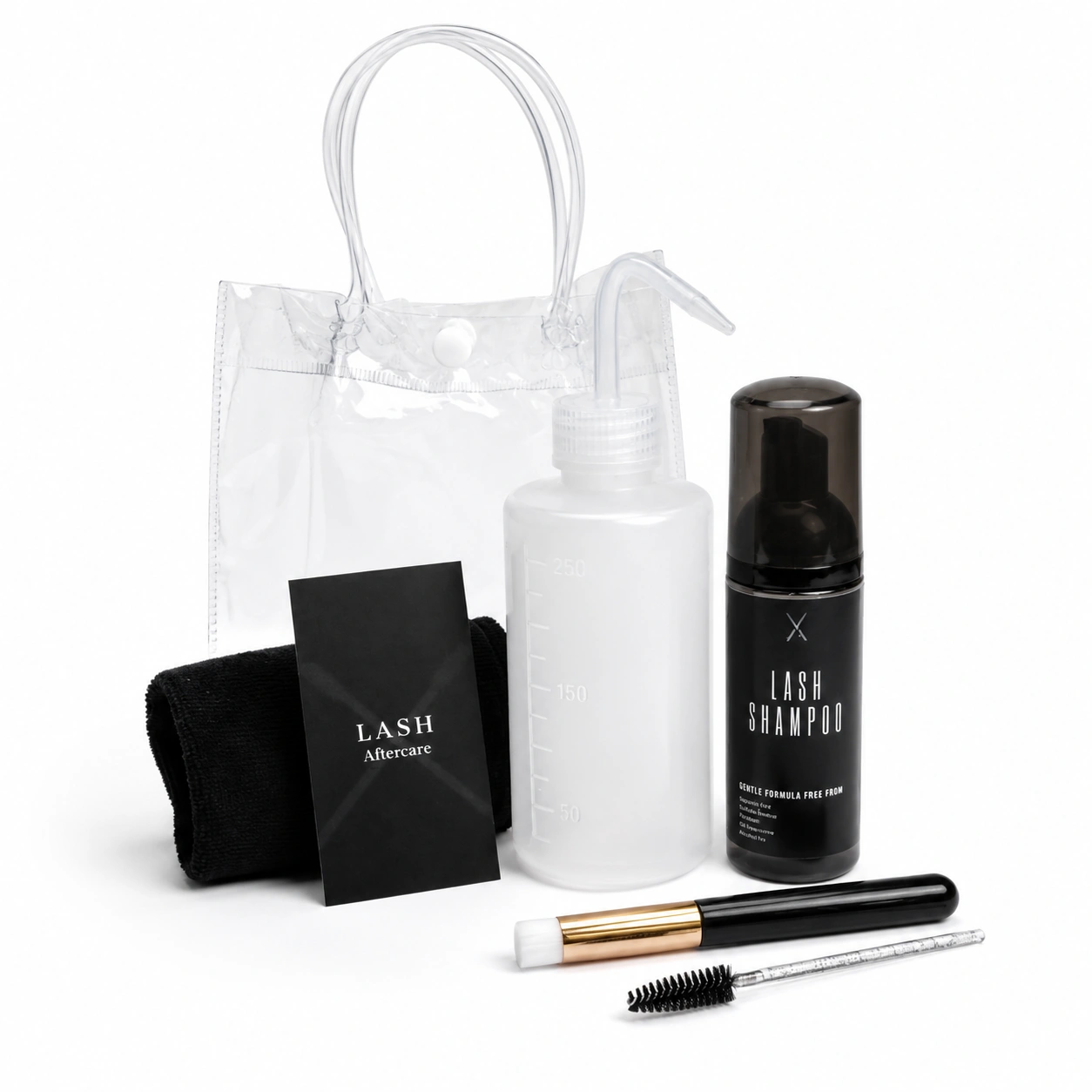 Black Transparent Deluxe Lash Kit in a clear PVC bag containing a lash shampoo bottle, cleansing bottle, soft face cloth, eyelash wand, cleansing brush, and aftercare card. Complete lash extension cleansing and aftercare set for maintaining clean, healthy lashes.