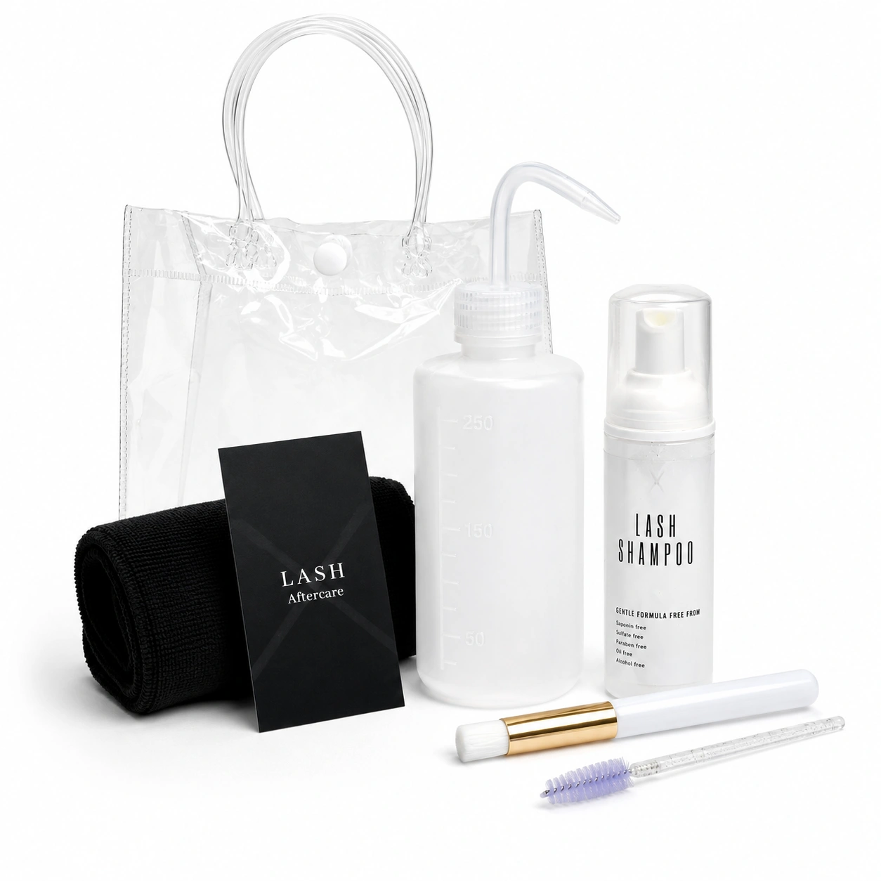White Transparent Deluxe Lash Kit in a clear PVC bag containing a lash shampoo bottle, cleansing bottle, soft face cloth, eyelash wand, cleansing brush, and aftercare card. Complete lash extension cleansing and aftercare set for maintaining clean, healthy lashes.